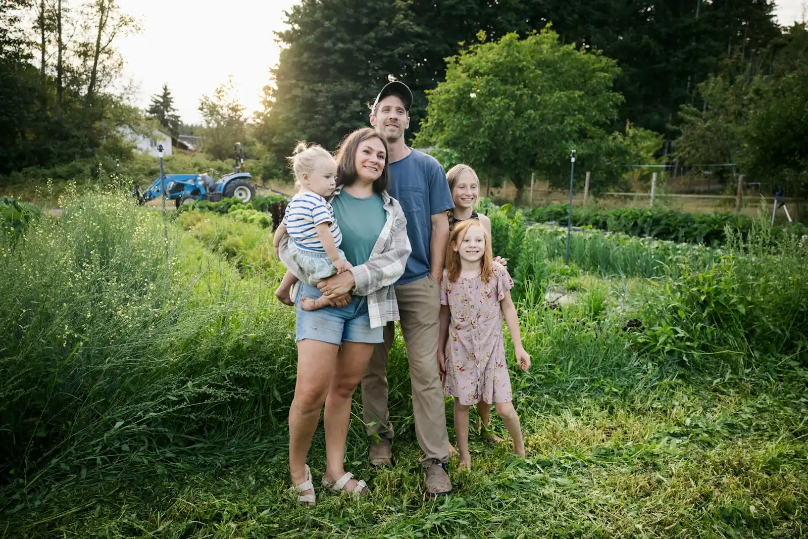 A family standing in a green field